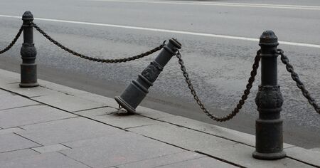 Broken old sidewalk fenceの写真素材