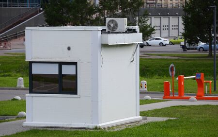 The checkpoint with a gate and security booth