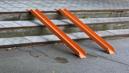 Metal ramp for entry of wheelchairs through the stepsの写真素材
