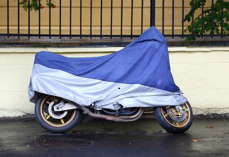 Motorcycle covered with a coverの写真素材