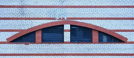 Basement window with a metal barrierの写真素材