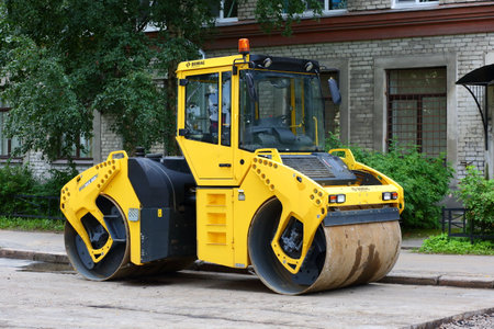 Machine for laying pavement ulitsa Kharchenko Saint Petersburg Russia August 2019のeditorial素材