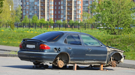 A broken passenger car without wheels stands on bricks, Podvoysky ulitsa, Saint Petersburg, Russia, may 2020のeditorial素材