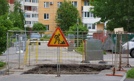 Road repairs marked with the sign "Earthworks"の写真素材