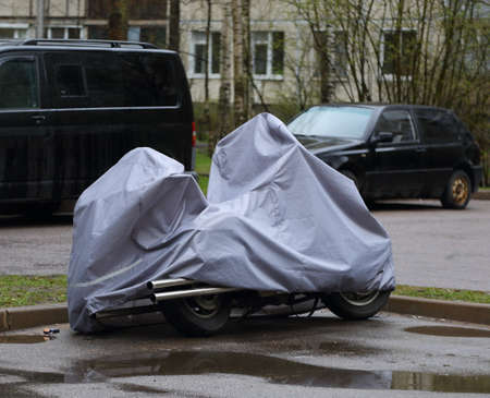 The motorcycle is covered with a coverの写真素材