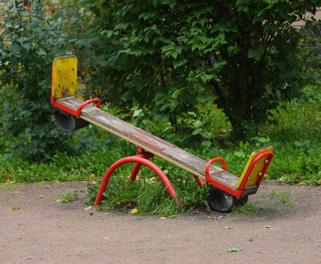 Small wooden children's swing on the playgroundの写真素材