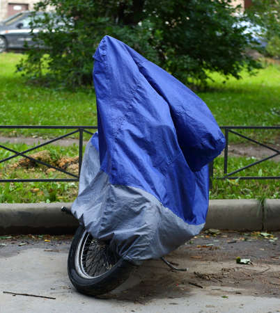 Motorcycle covered with a coverの写真素材