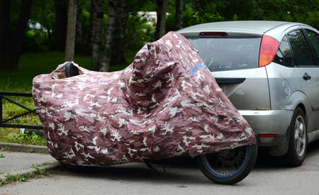 Motorcycle covered with a coverの写真素材