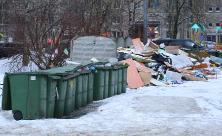 Garbage containers in a waste place in the courtyard of a residential building