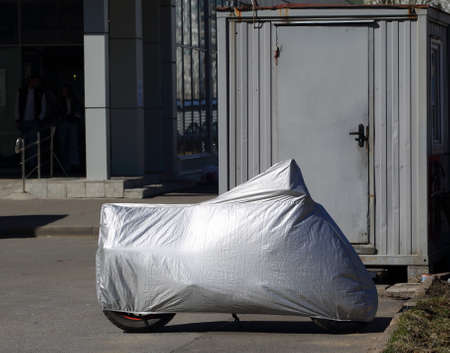 Motorcycle covered with a coverの写真素材