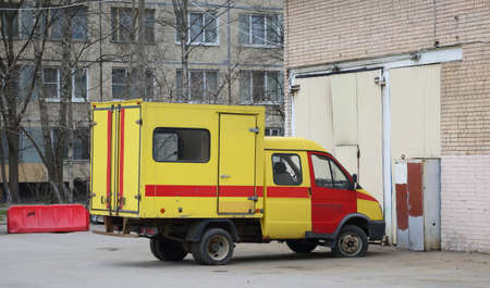 Yellow-red special emergency vehicle with flat front wheel