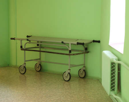 A trolley with a medical stretcher in the corridor of the clinic by the windowの写真素材