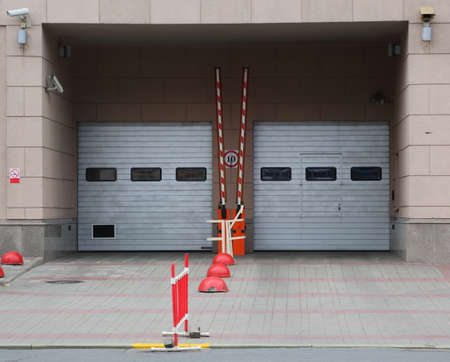 Gray metal entrance gate to the underground parking