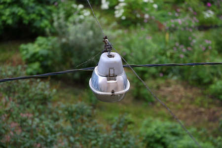 Top view of an electric lantern on tripwires over the park
