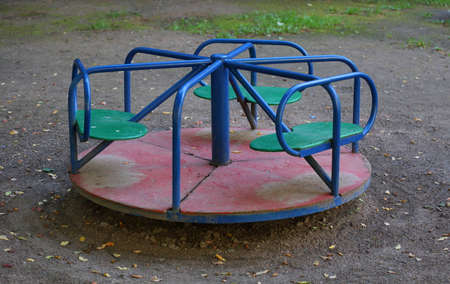 Children's carousel on the playground in the yardの写真素材