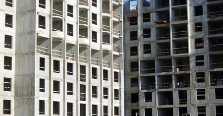 Facade of a new modern apartment building under construction