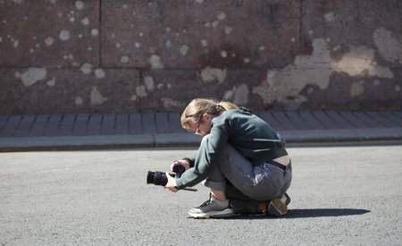 Blonde girl photographer on the street