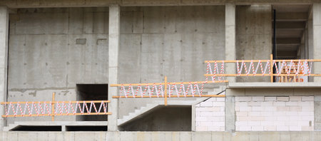 Stairs on the floor of a concrete house under construction