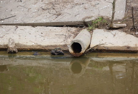 An old concrete sewer pipe on the canal bank