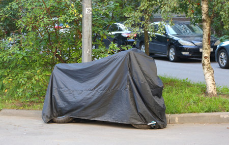 Motorcycle covered with a coverの写真素材