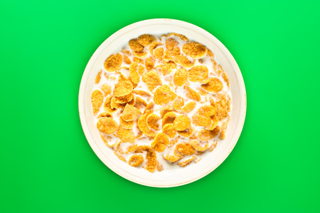 bowl with cornflakes on the colorful backgroundの写真素材