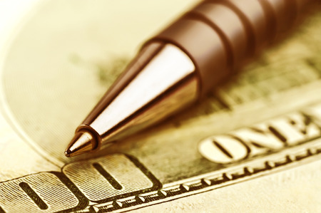 close-up pen on the money with shallow DOFの写真素材