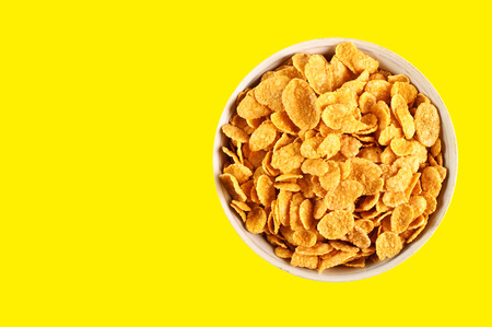bowl with cornflakes on the colorful background