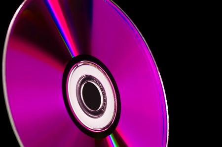 close-up computer cd dvd blue-ray disk isolated on blackの写真素材