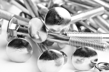 close up heap of  bolts and nutsの写真素材