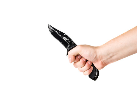 close-up knife in hand isolated on white