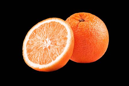Macro photo of whole fruit orange and slice isolated on black backgroundの写真素材