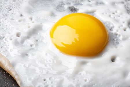 Macro photo background of close-up fried eggの写真素材
