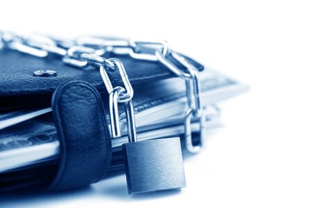 Business safety or financial protection or allow access. Heap of money in chain with open padlock isolated on whiteの写真素材