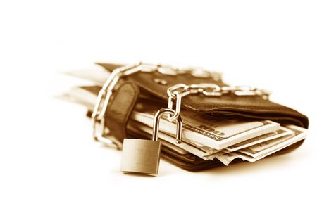 Business safety or financial protection or allow access. Heap of money in chain with open padlock isolated on whiteの写真素材