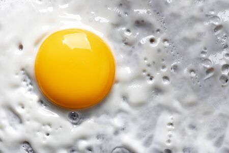 Macro photo background of close-up fried eggの写真素材