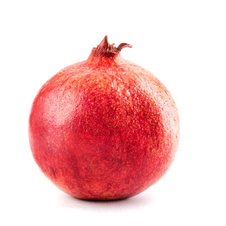 Macro photo of closeup pomegranate isolated on white backgroundの写真素材