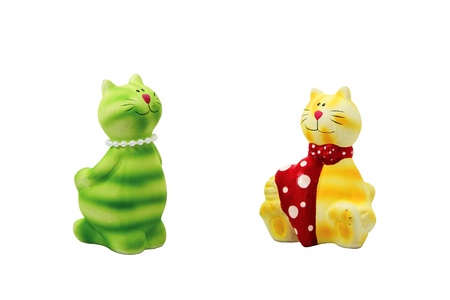 Two statues of cats on a white background, isolated.の写真素材