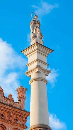 A statue of the Virgin on a background of blue sky in front of the town hall in Sandomierz  Polandのeditorial素材