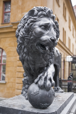 Lion statue, which rests on a globe with a royal crown  Sweden  Stockholmの写真素材