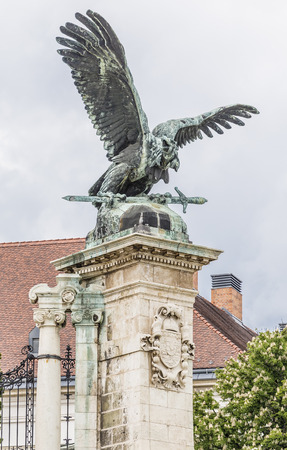 Sculpture of eagle with a sword in its claws on the gates of the royal palace. Budapest. Hungaryの写真素材