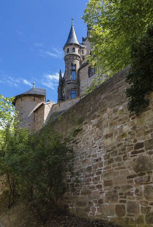 The old German castle on the hill in the Gothic Revival style. Wernigerode. Germanyのeditorial素材