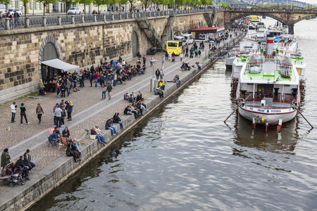 PRAGUE, CZECH REPUBLIC - 02 APRIL, 2015: Embankment of the Vltava river with a boat moored on the Sabbath.のeditorial素材