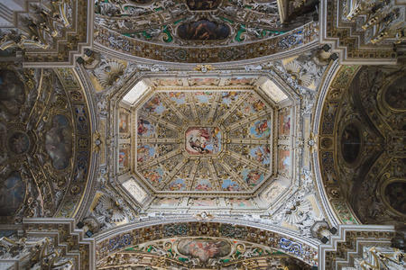 A rich decorative ceiling painting and stucco in the Basilica of Santa Maria Maggiore. Brescia. Italy.のeditorial素材