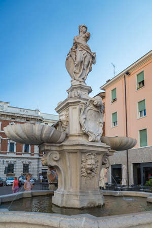 Brescia, Italy - August 30, 2015: Stone fountain in Piazza Paolo VI with a sculpture of a warrior and two bowls in the form of shellsのeditorial素材