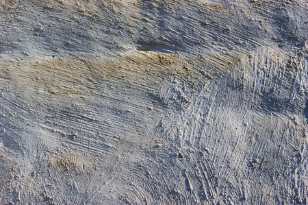 Whitewashed wall with yellow stains 