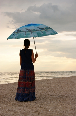 The woman on the seashore の写真素材