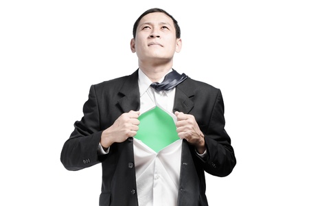 Businessman showing a superhero suit underneath his suitの写真素材