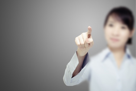 Girl Press a button, isolated on whiteの写真素材