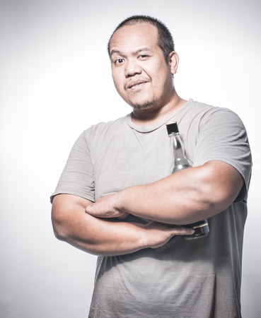 Man holding alcohol bottleの写真素材