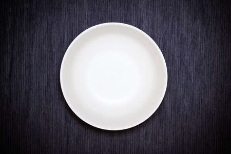 white empty bowl on black backgroundの写真素材